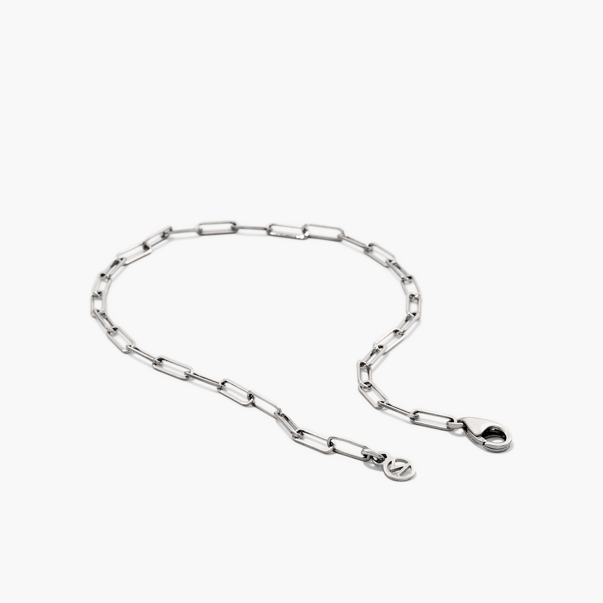 Boyfriend Bold Bracelet: a silver chain with a clasp, featuring a logo. Perfectly complements raw, loose, and bold fashion styles.