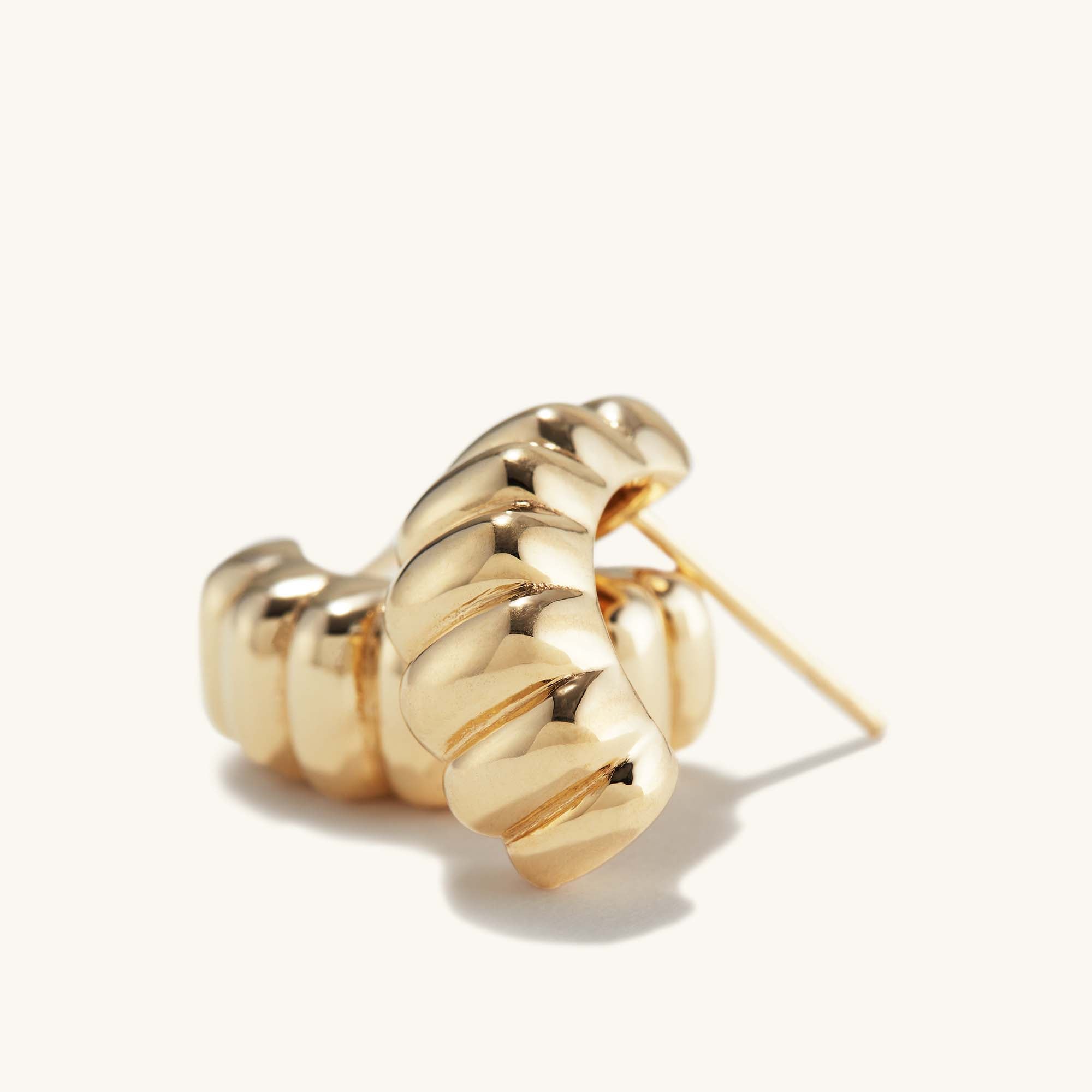 Charlotte Hoops: a pair of intricately designed gold earrings, inspired by the iconic French dessert, perfect for adding elegance to any look.