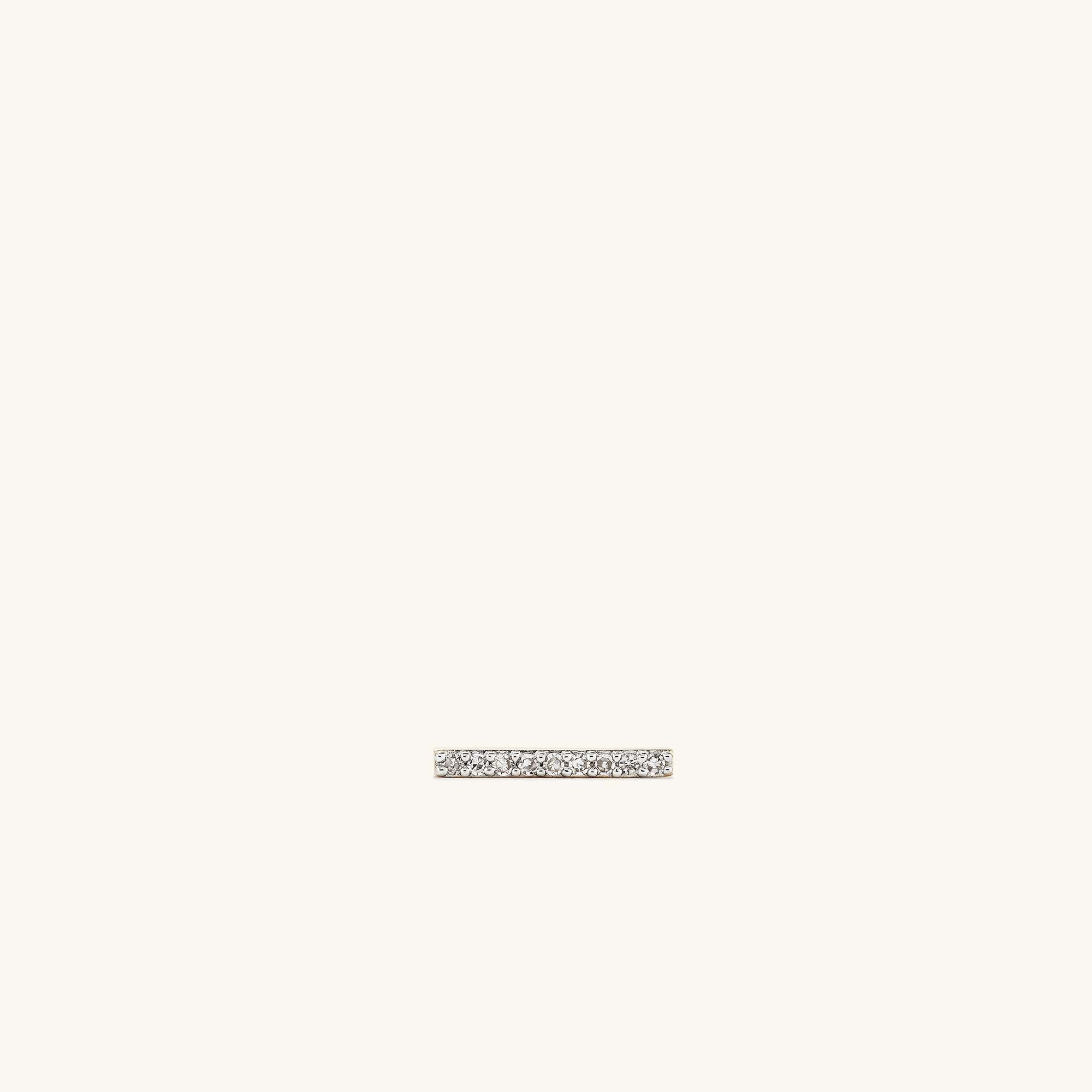 Single PavÃ© Diamonds Long Bar Stud: A small silver ring adorned with tiny diamonds, handcrafted in 14k solid gold, designed for elegance. Sold individually.