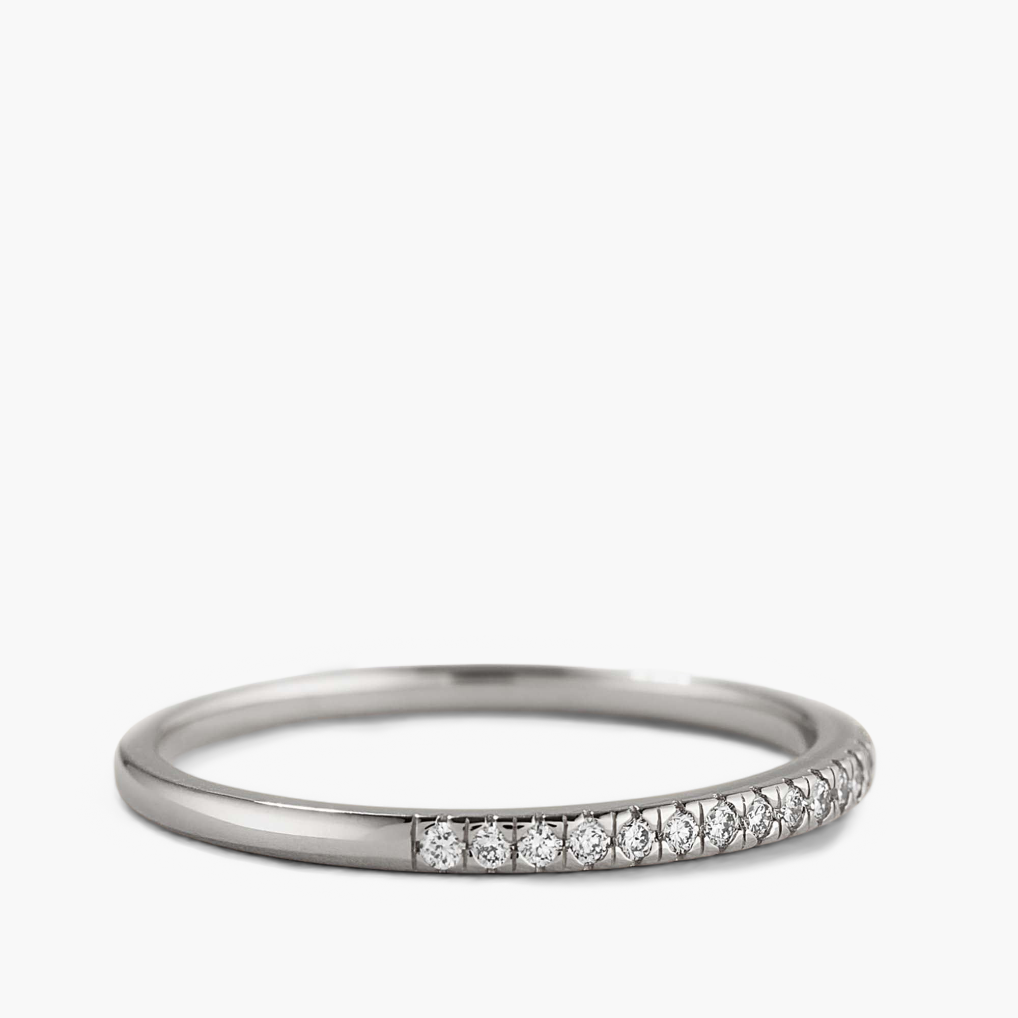 Silver ring with diamonds, titled Diamonds Team Ring, showcasing intricate details and elegance. Complements stacker rings, enhancing any outfit.