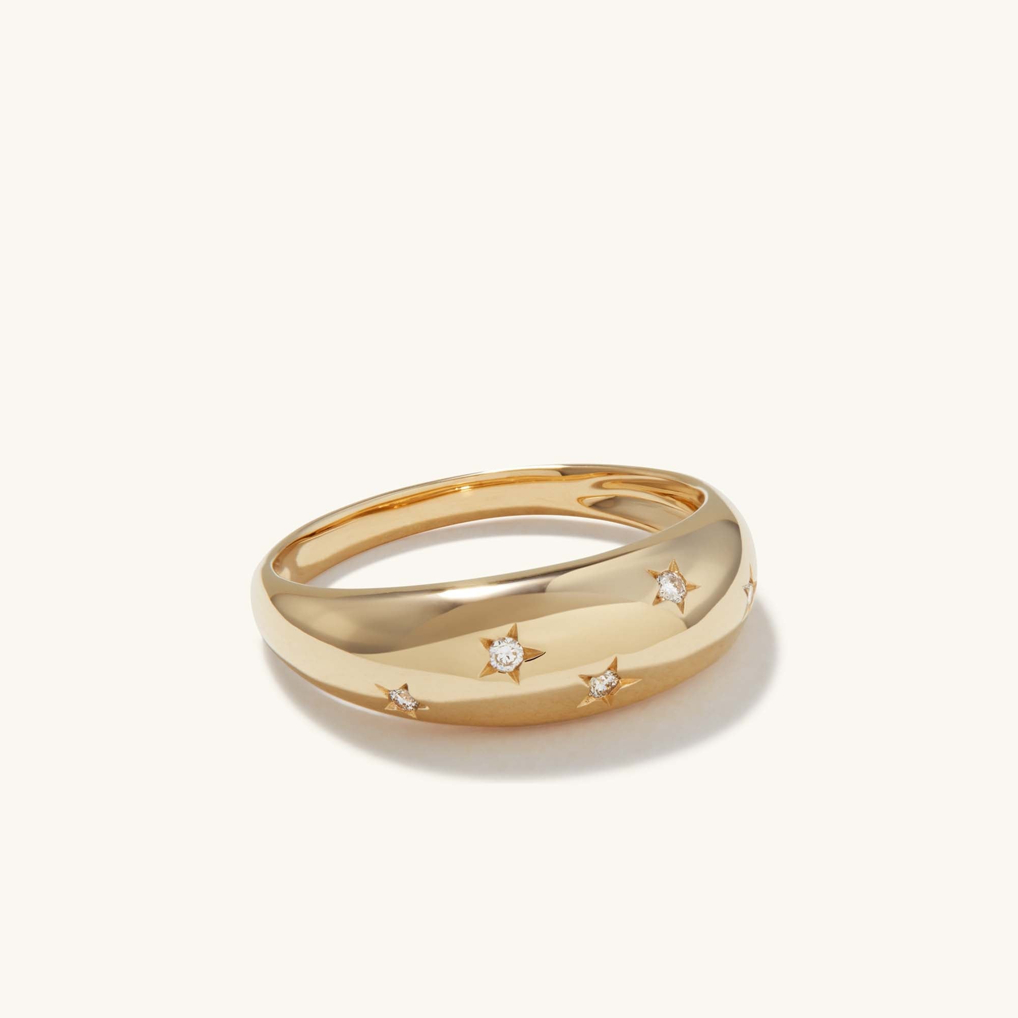 Celestial DÃ´me Ring: Gold ring adorned with diamonds and star motifs, exuding glamour and elegance, perfect for adding a touch of celestial charm.