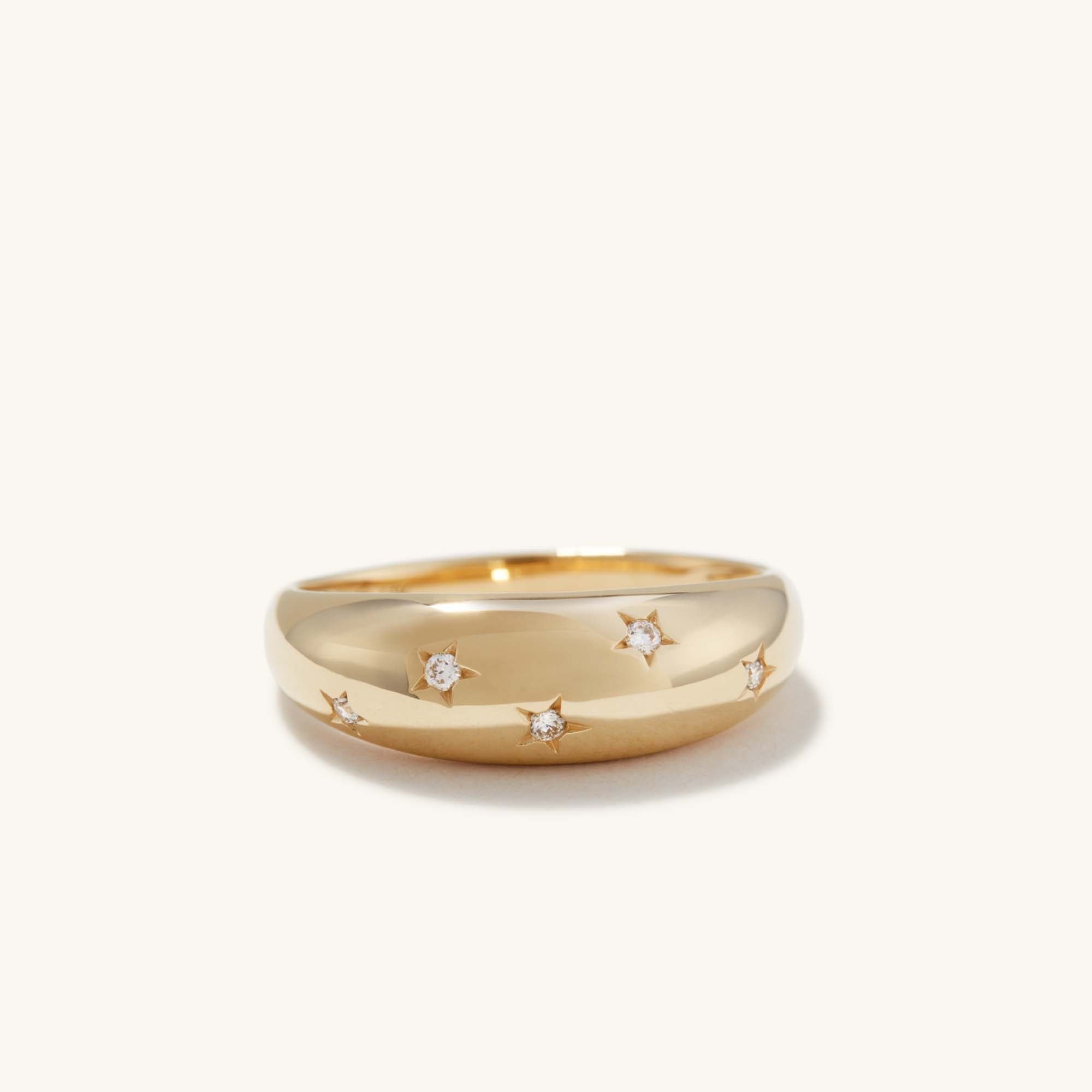 Celestial DÃ´me Ring featuring a gold band adorned with diamonds, capturing a starry motif that exudes elegance and sophistication.