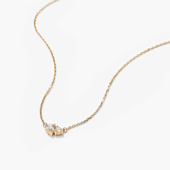 Hue Necklace: A 14k gold necklace featuring genuine white topaz gemstones, showcasing a delicate and elegant design perfect for layering.