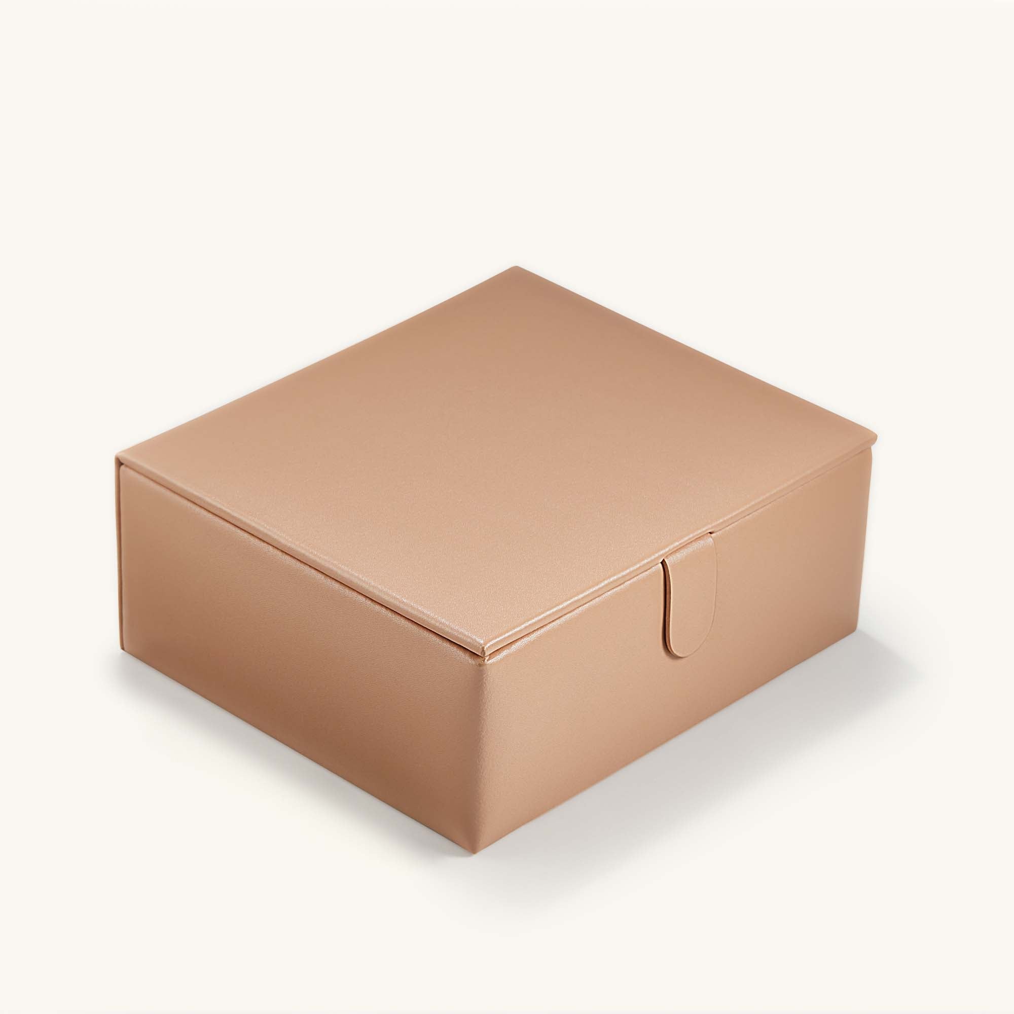 Close-up of a jewelry box with three removable trays and specialized compartments for organizing jewelry.