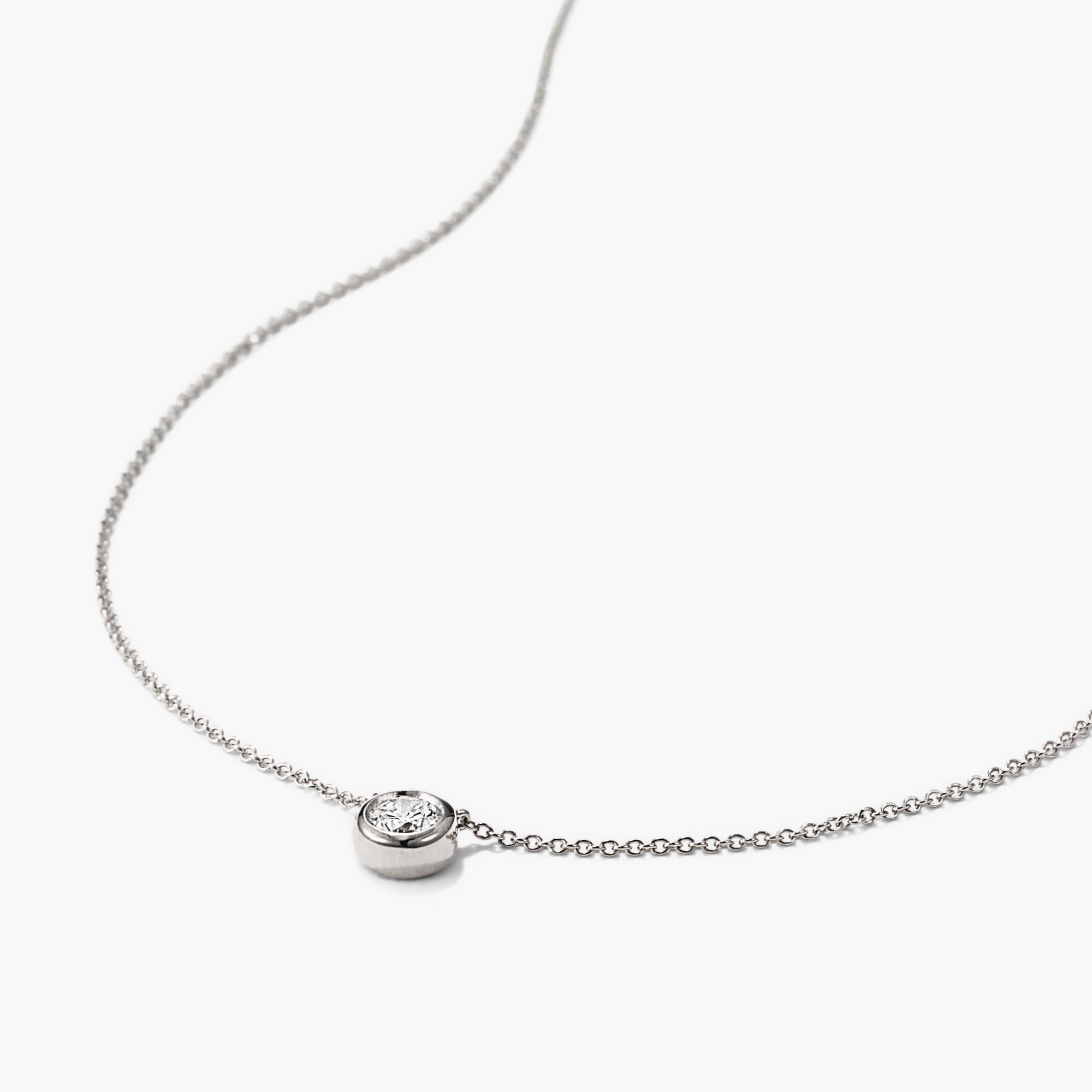 Large Diamond Necklace with a silver chain and a small, round diamond pendant, designed as an heirloom-worthy piece for timeless elegance.