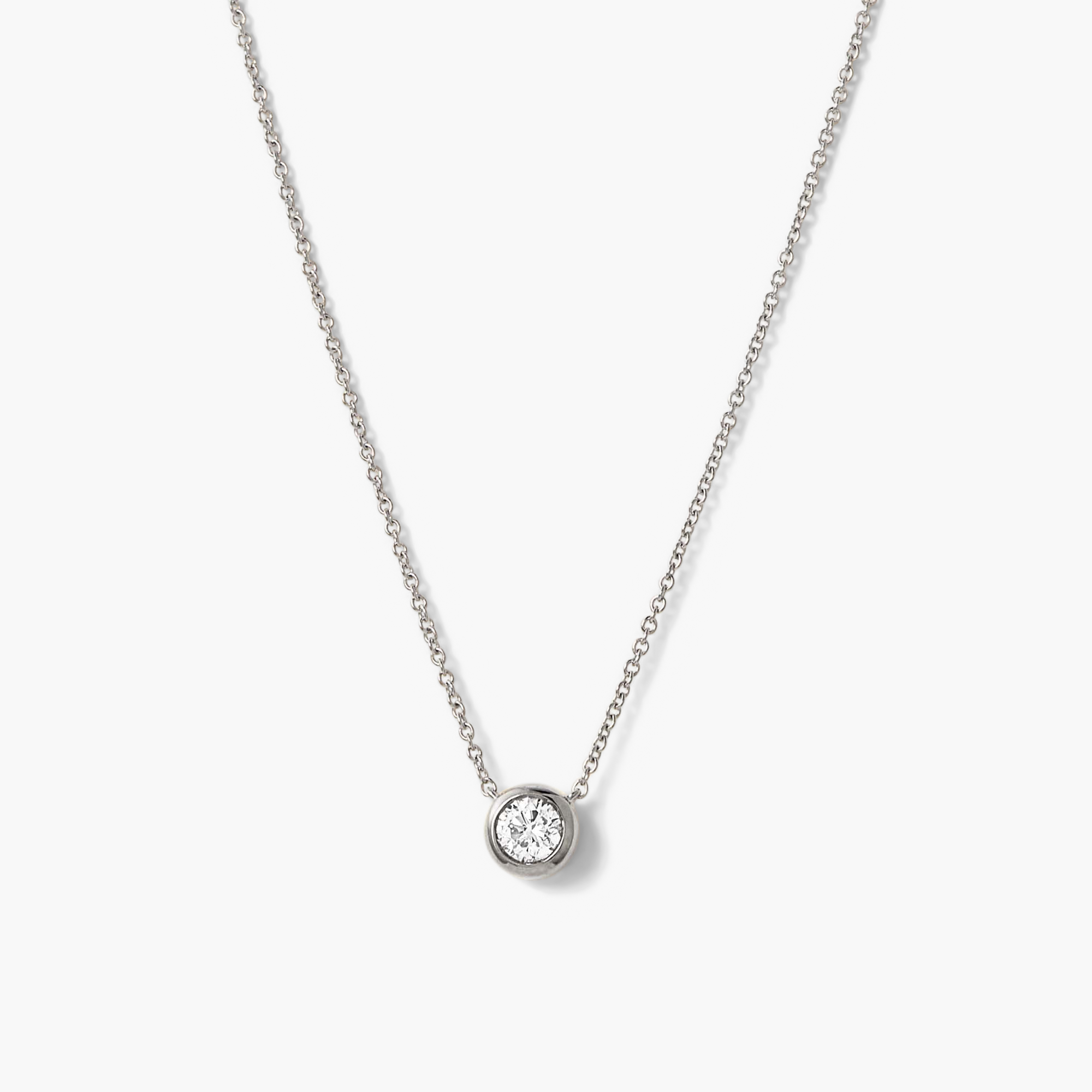 Large Diamond Necklace featuring a sparkling diamond pendant on a long silver chain, designed for elegance and timeless wear.