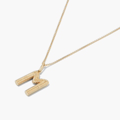 Bold Letter Pendant Necklace: An 18k gold vermeil necklace with an accordion-patterned letter pendant, displayed on a 20 to 22-inch cable chain.