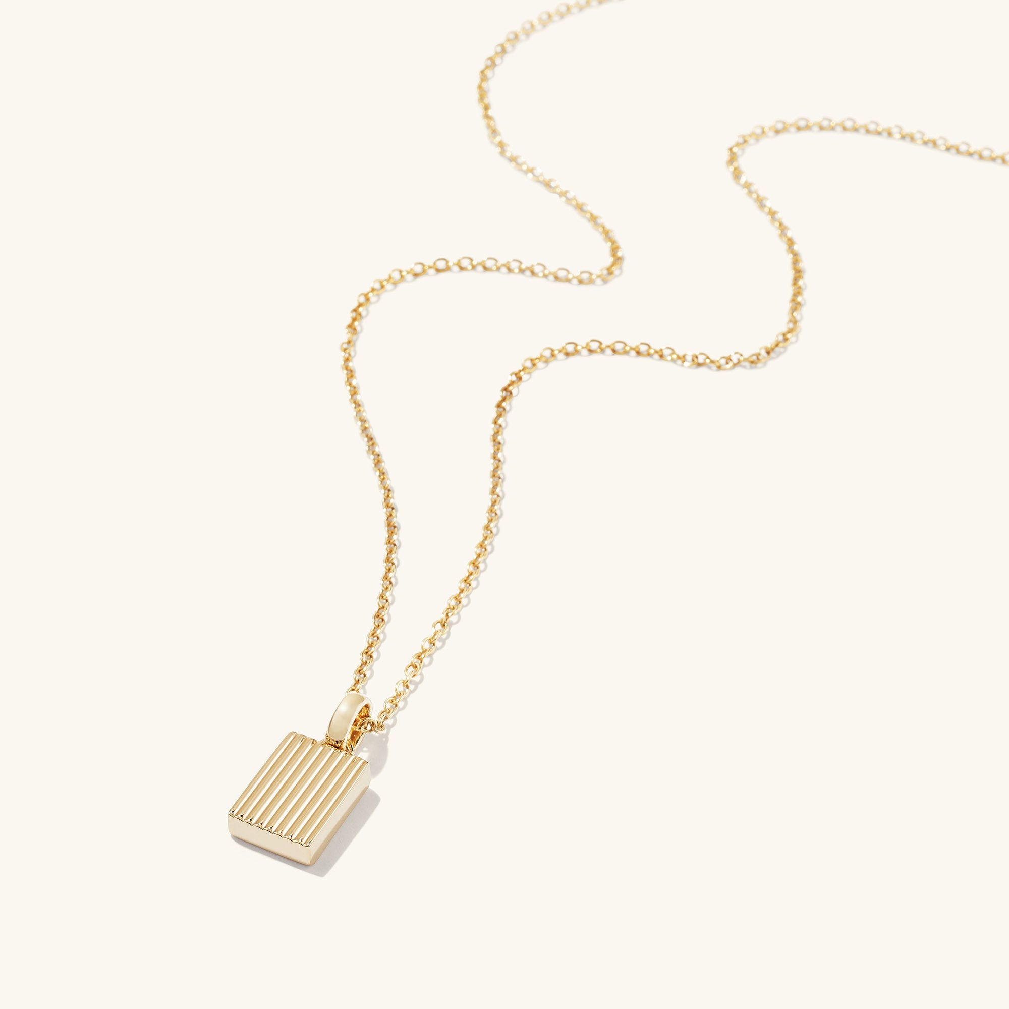 Black Onyx Pendant Necklace featuring a gold square pendant on a delicate chain, highlighting a striking touch of onyx for an elegant look.
