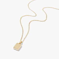 Black Onyx Pendant Necklace featuring a gold square pendant on a delicate chain, highlighting a striking touch of onyx for an elegant look.