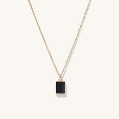 Black Onyx Pendant Necklace featuring a black square pendant on a delicate chain, blending elegance with a strong touch of onyx.