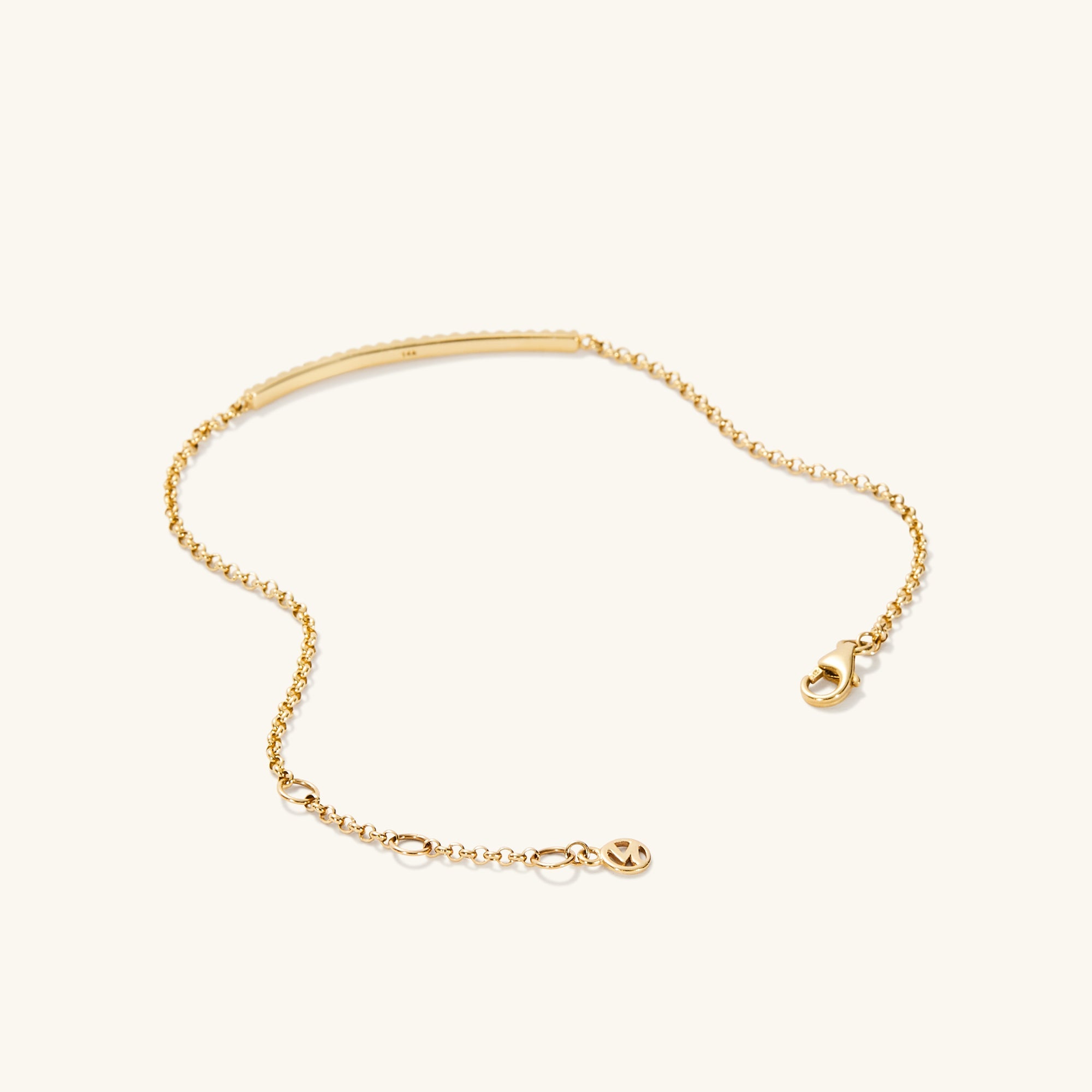 Pave Diamond Bar Bracelet featuring a sleek gold chain with an elegant bar pendant, reflecting a sophisticated jewelry design.