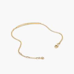 Pave Diamond Bar Bracelet featuring a sleek gold chain with an elegant bar pendant, reflecting a sophisticated jewelry design.