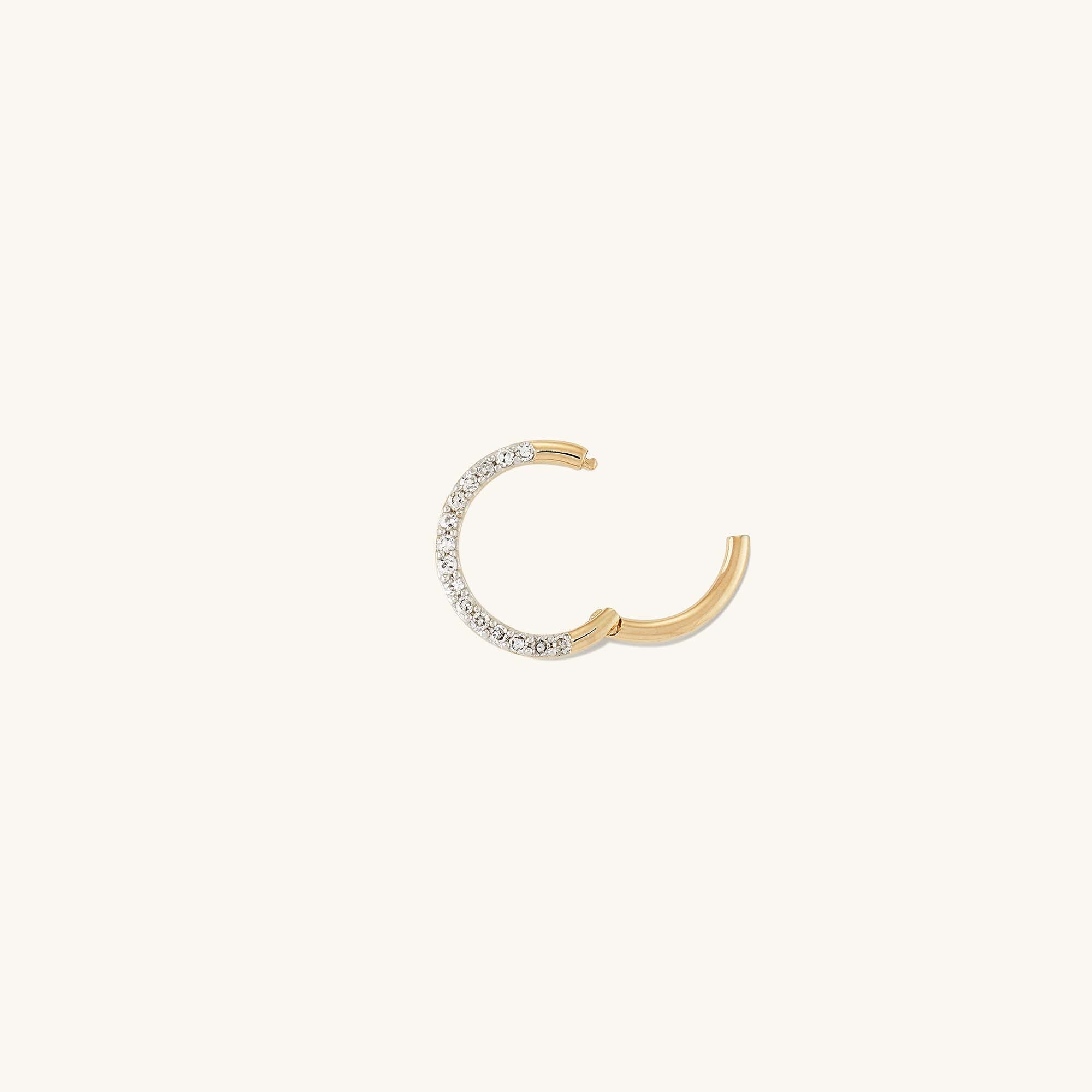 Cartilage PavÃ© Diamond Mini Hoop: A lightweight, handcrafted 14k gold hoop with pavÃ© diamond setting, designed for the helix, featuring an easy hinge clasp. Sold individually.