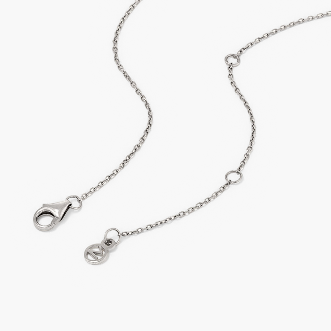 Large PavÃ© Diamond Round Necklace: a silver chain with a clasp, featuring a round pendant handcrafted in 14k solid gold and set with pavÃ© diamonds.