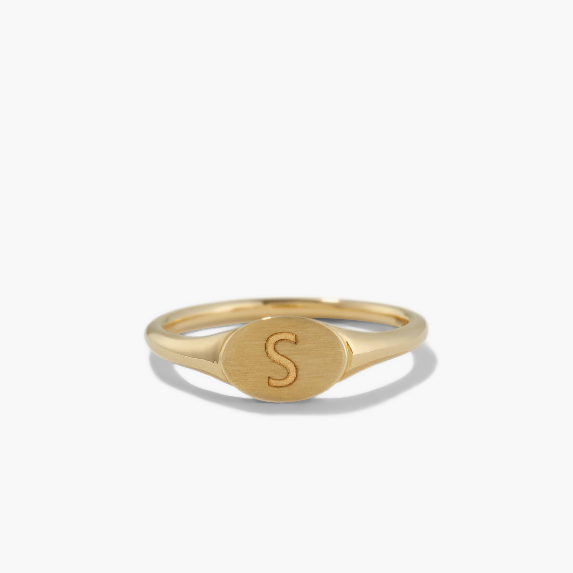 Gold signet ring engraved with the letter S, featuring a smaller, bold design in 14k solid gold with a customizable bezel surface.
