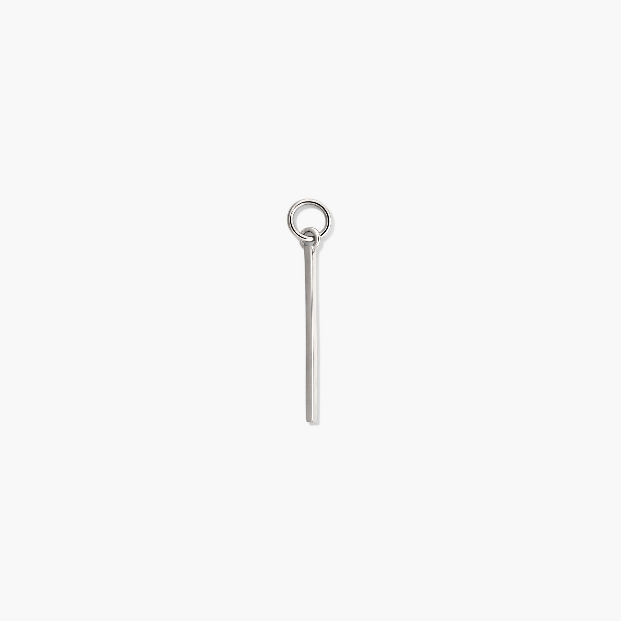 Single Bar Hoop Charm: A silver rectangular charm with a ring, designed to personalize and enhance everyday hoop earrings with a high-impact look.