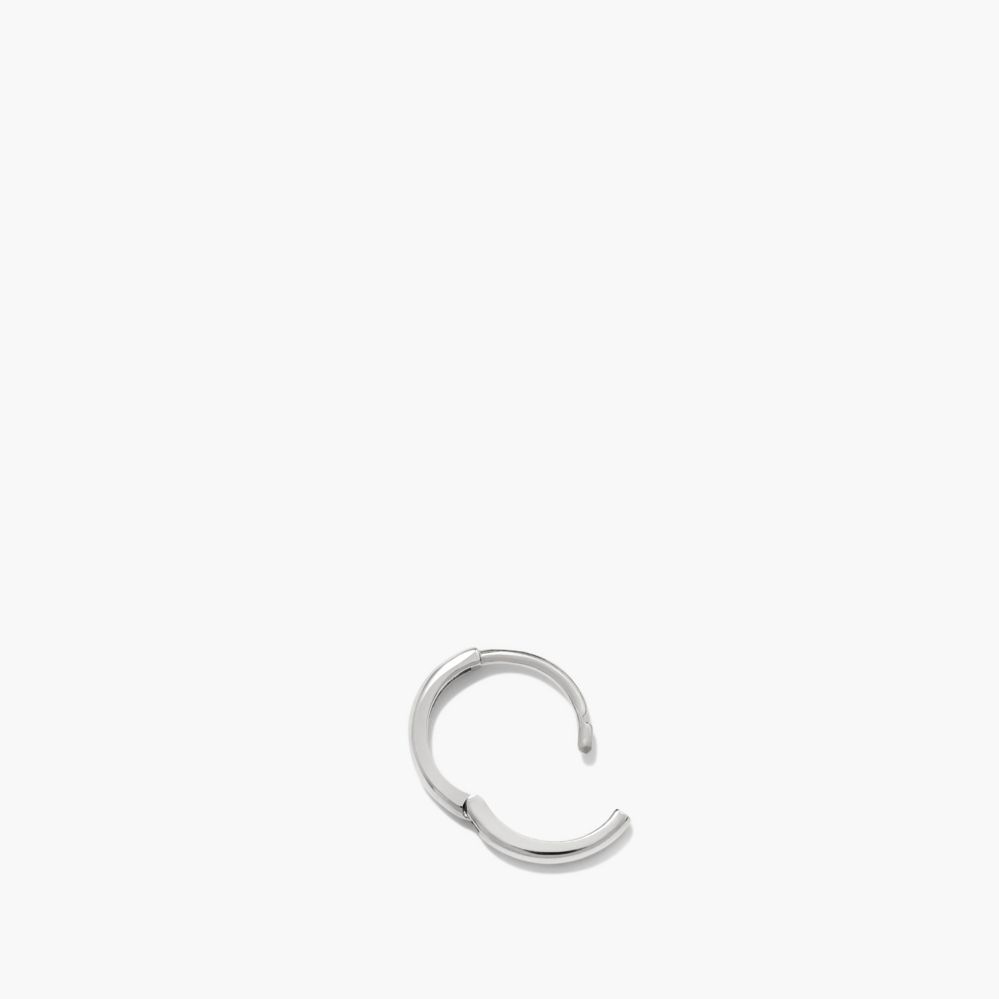 Mini Hoop: A lightweight silver-tone hinged hoop earring, designed for daily wear. Features an easy-to-use hinge clasp. Sold individually.