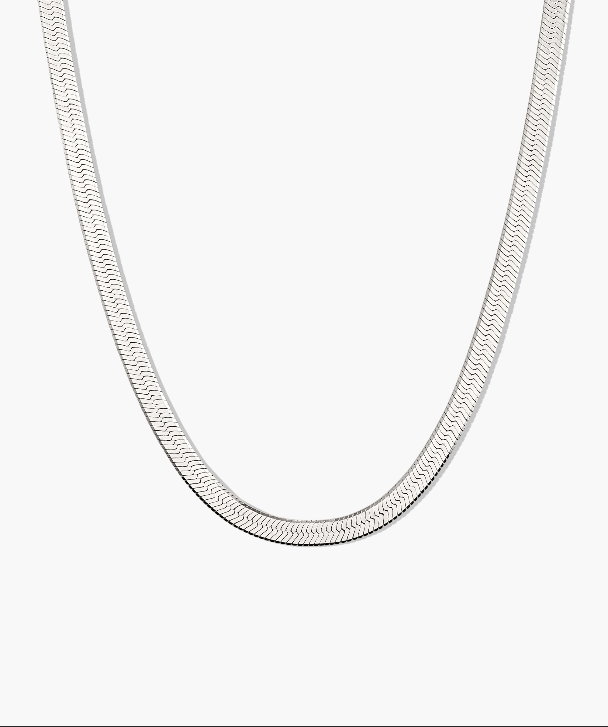 Bold Herringbone Chain Necklace shown in a classic U-shape, offering a sleek, versatile design. Available in various lengths for solo or layered styling.