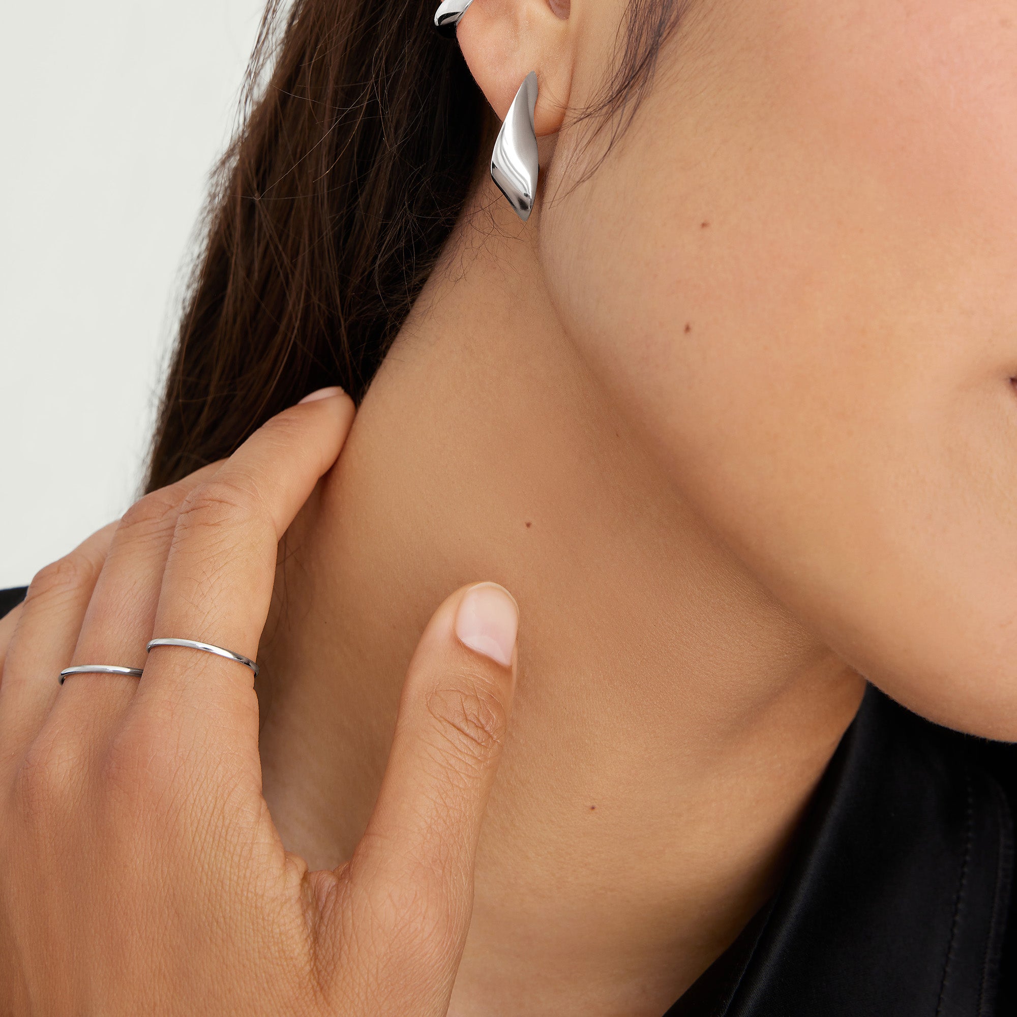 Stacker Ring on a woman's finger, close-up of the hand and ring showcasing its minimalist design, perfect for everyday wear and versatile styling.