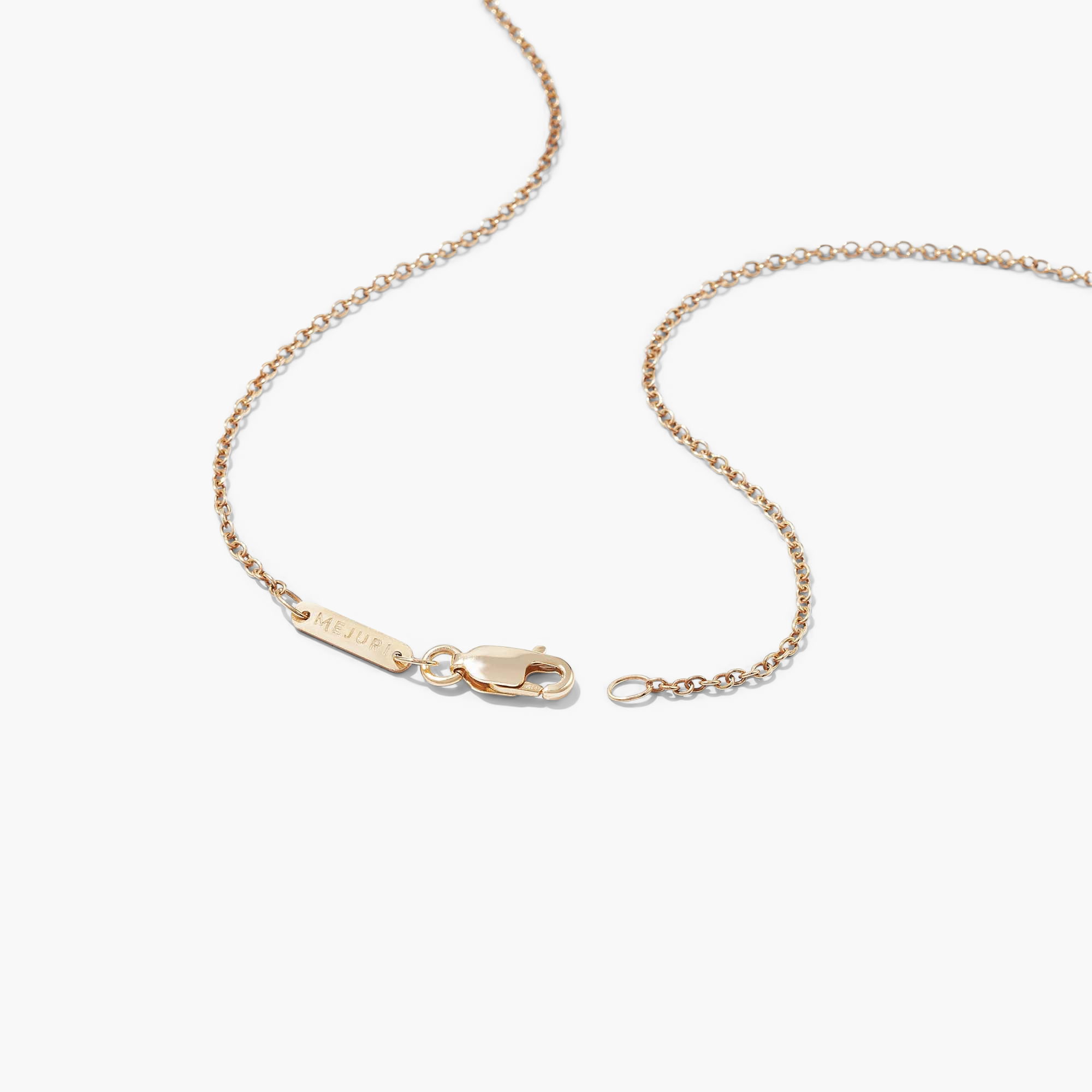 Black Onyx Pendant Necklace featuring a detailed gold chain with a tag, displayed on a white surface.