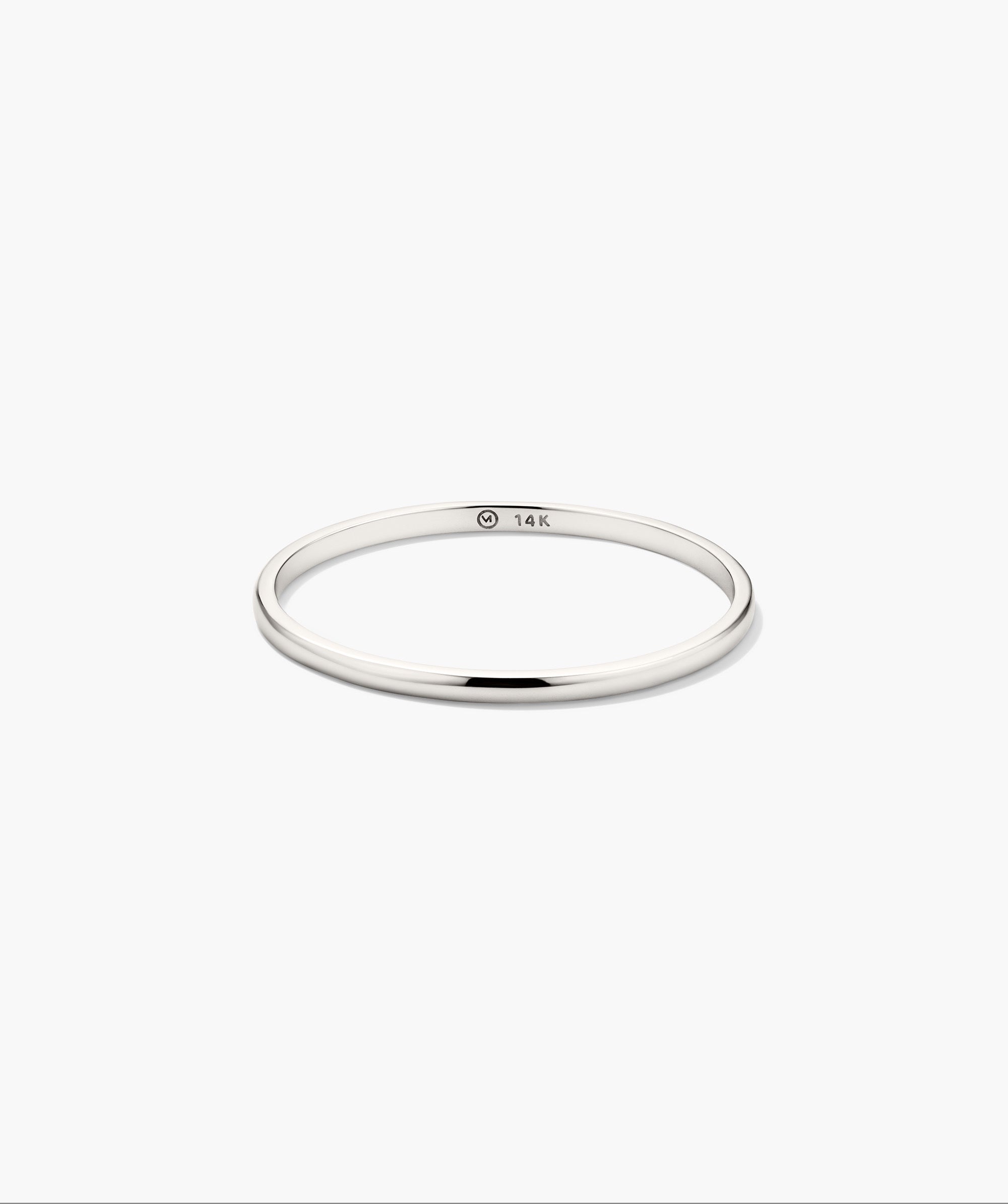 Stacker Ring: A sleek, high-polish white gold band with a 14K hallmark, minimalist in design, perfect for stacking or as a standalone piece.