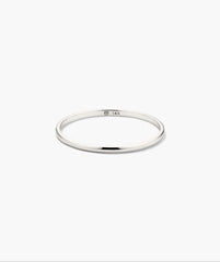 Stacker Ring: A sleek, high-polish white gold band with a 14K hallmark, minimalist in design, perfect for stacking or as a standalone piece.